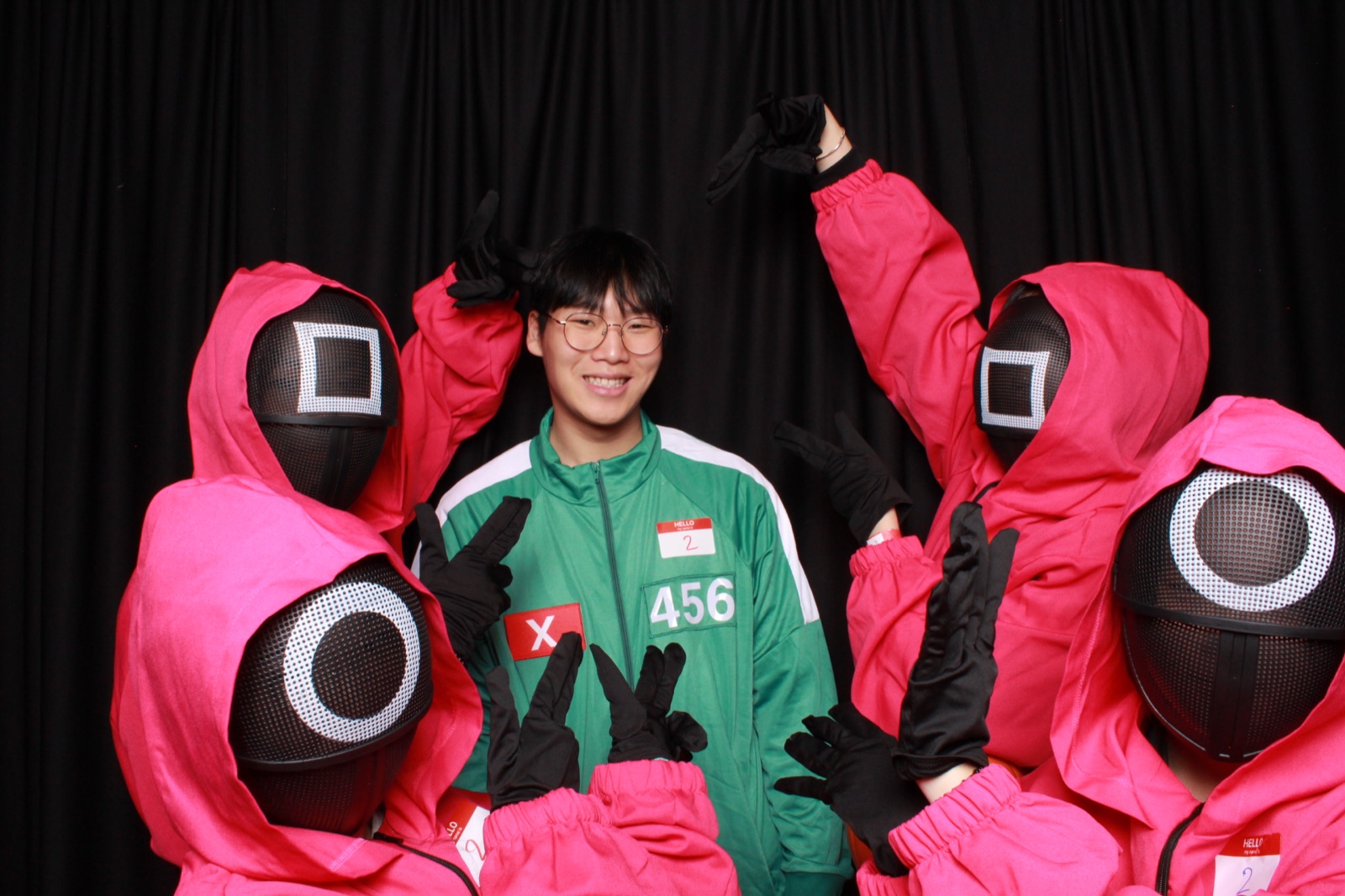 Students in costume at a college Halloween event photo booth