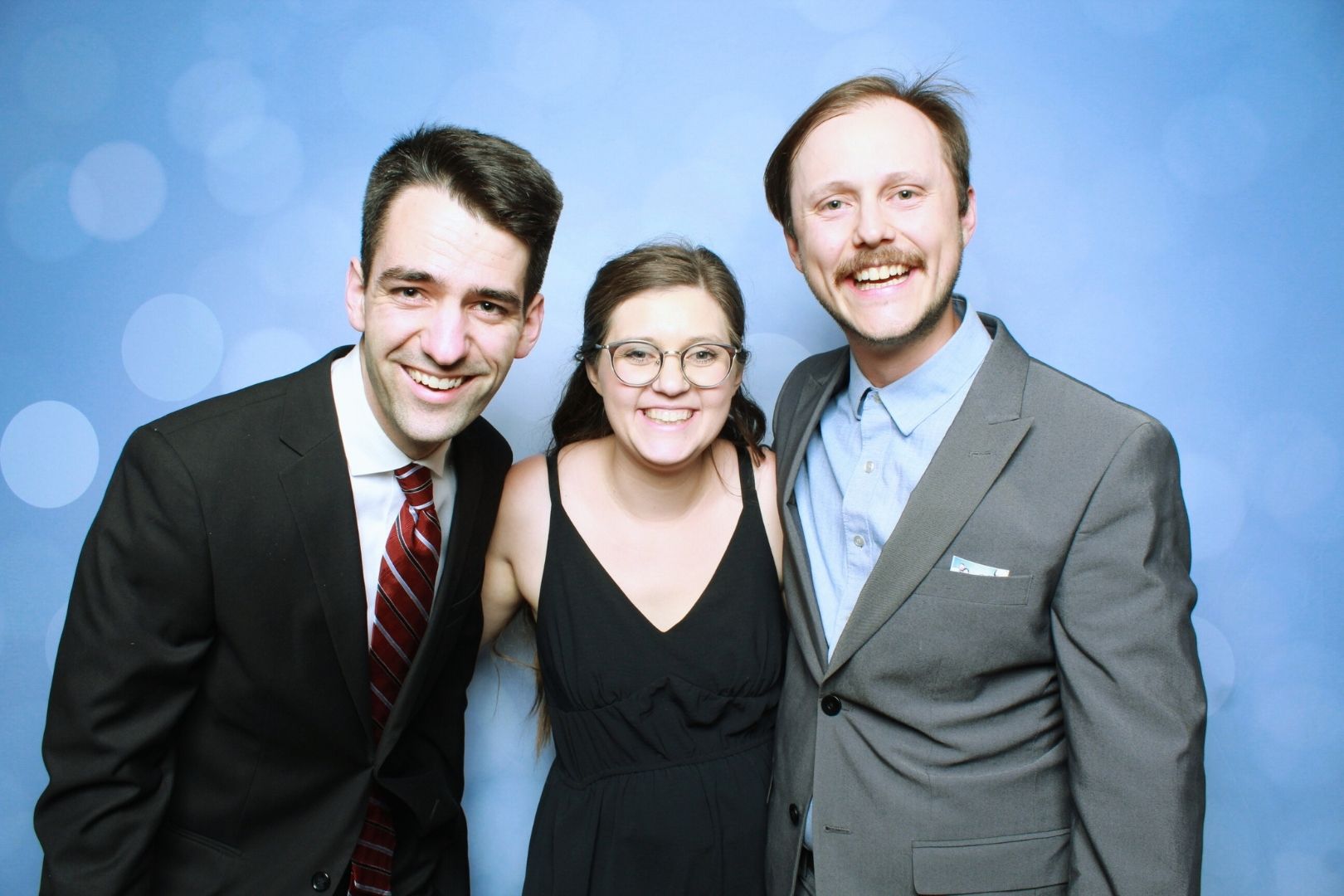 Guests at a TBD Photo Booth at a Gig Harbor waterfront wedding